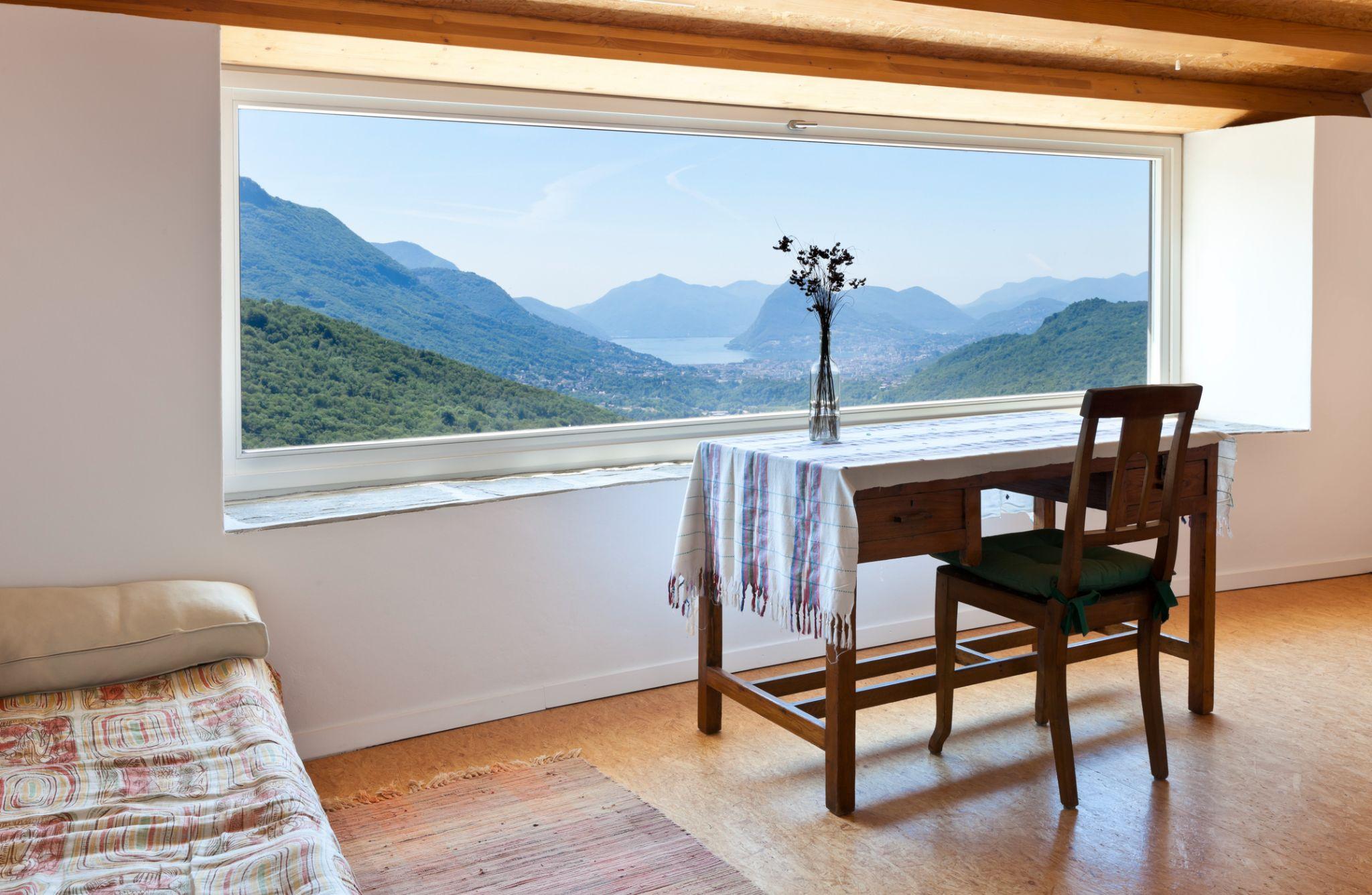 Large picture replacement window providing unobstructed outdoor views, improved natural light, and enhanced energy efficiency in a modern home.
