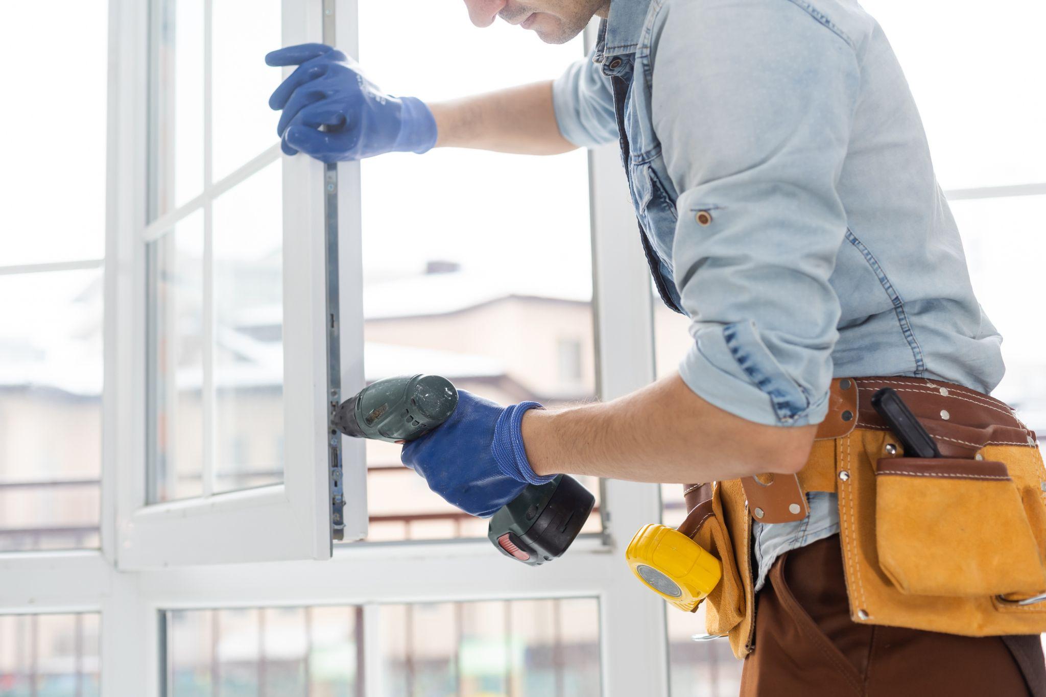 Professional installer securing a replacement vinyl window to ensure proper alignment, weather sealing, energy efficiency, and long-term performance.