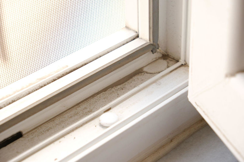 How to clean clogged window weep holes without damaging the frame