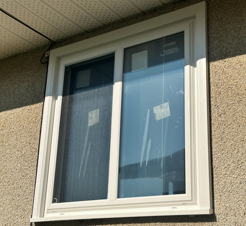 One replacement window at the Canadian Choice Windows & Doors Bon Accord project, viewed from outside